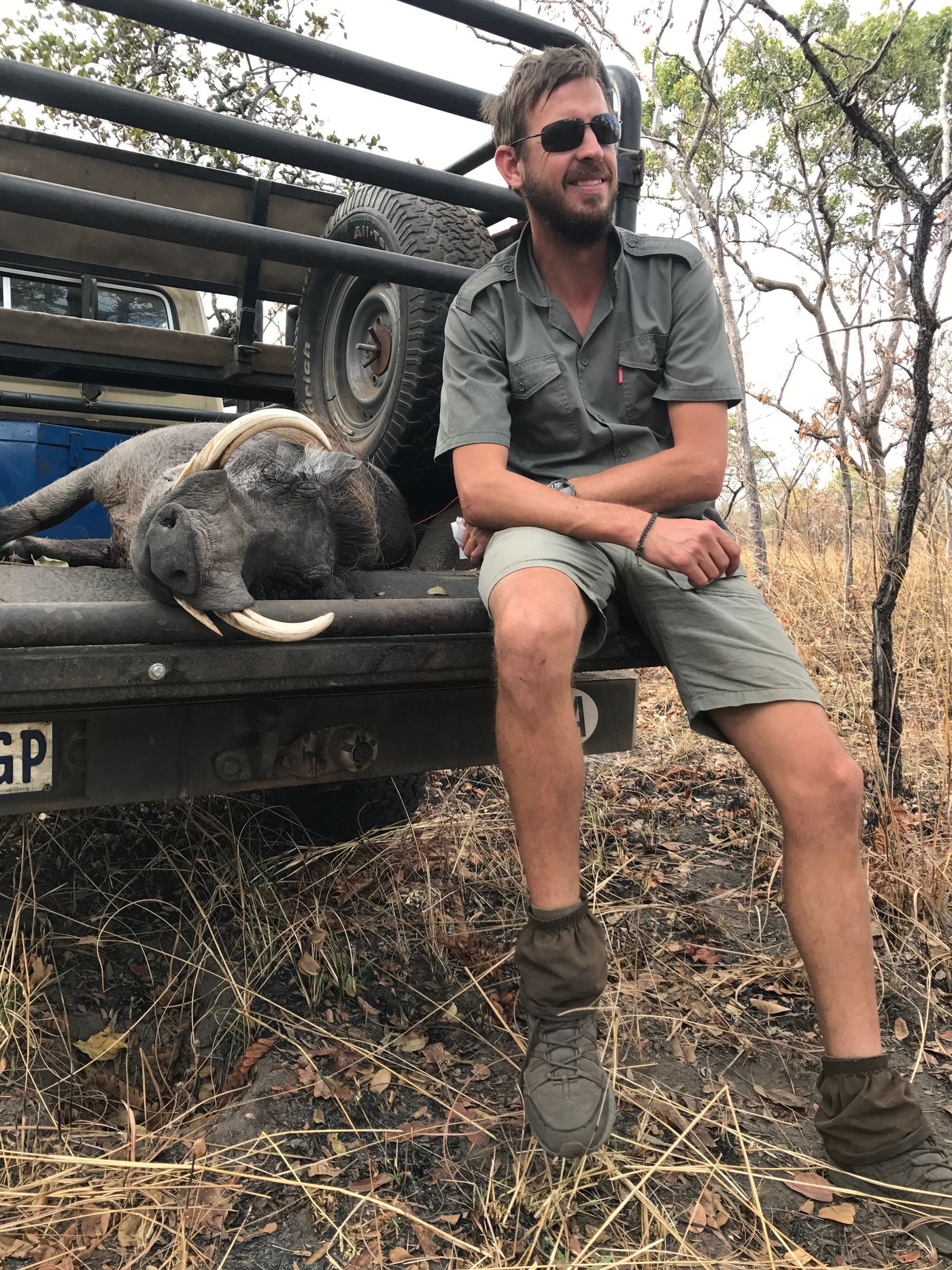 Jacques van Zyl on the truck bed after a buffalo hunt