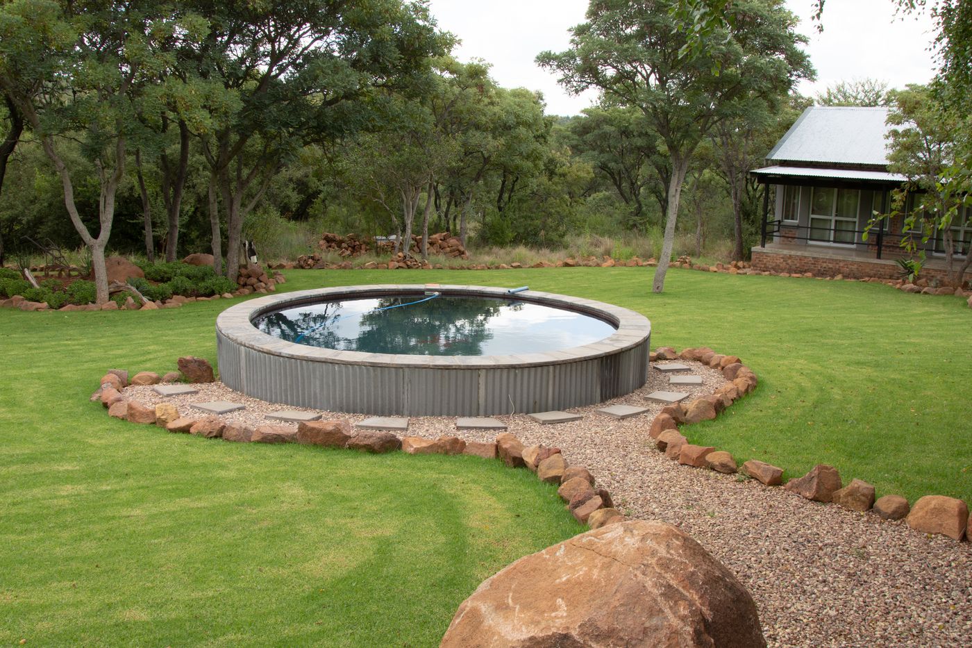Round plunge pool on the lawn at a JVZ lodge