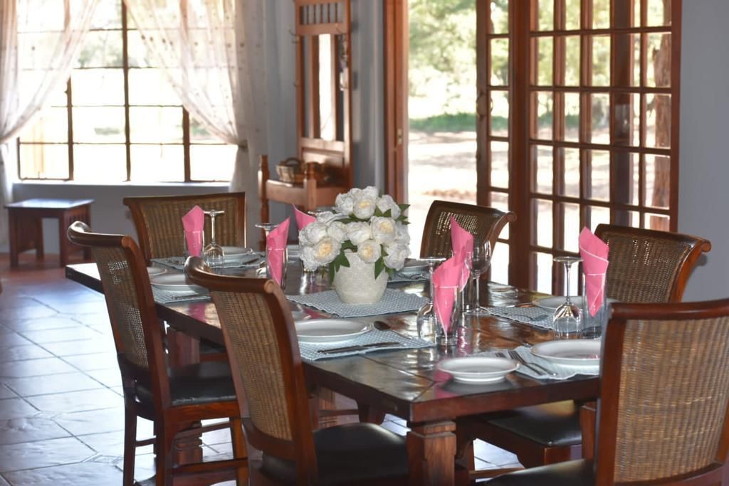 Dinner table set with linen at a JVZ lodge